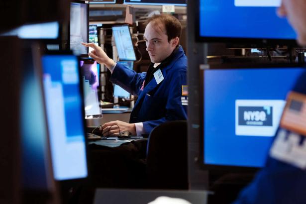 Photo of a trader at work on the floor of the New York Stock Exchange. 