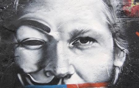 Julian Assange muzzled by USA flag